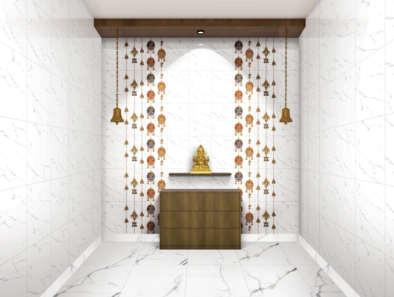 Pooja room design with white marble and golden deity statue